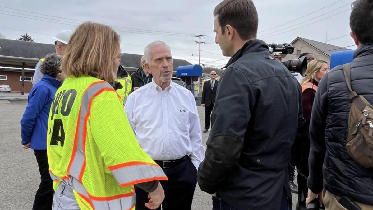 Congressman Chris Deluzio speaks with fellow congressmembers and EPA officials at Norfolk Southern derailment site