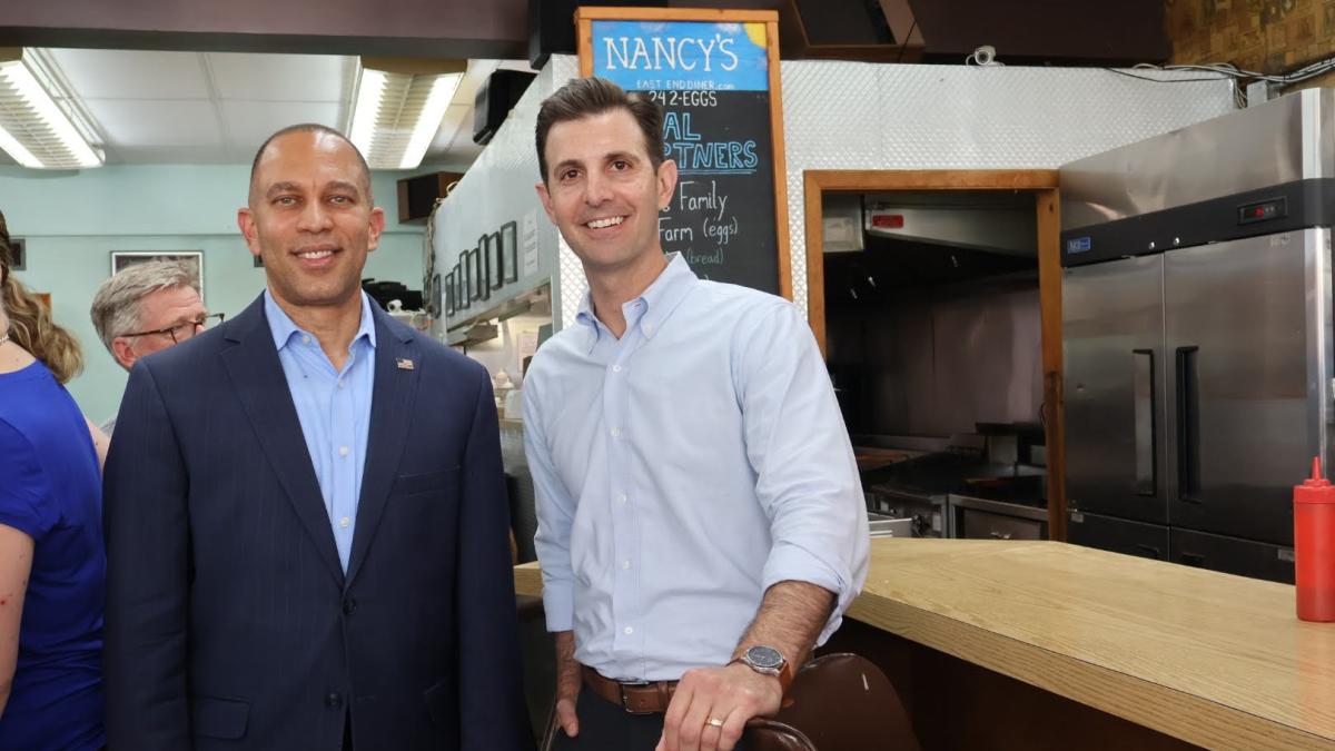 Rep. Deluzio and Leaders Jeffries smile for a photo at Nancy's Revival in Wilkinsburg, PA.