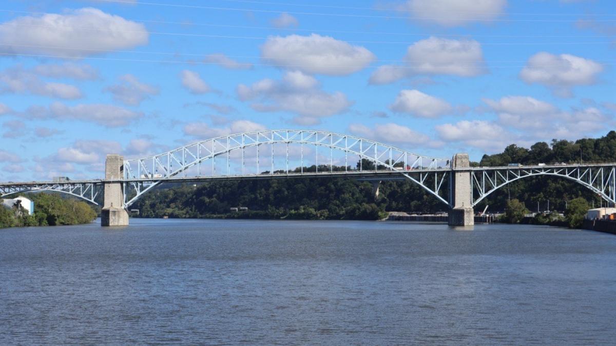 A bridge sits between river and sky in Western PA