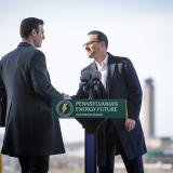 A photo of Congressman Deluzio shaking hands with PA Governor Josh Shapiro in front of a podium with a sign that reads "Pennsylvania's Energy Future"