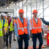 A photo of Congressman Deluzio with House Speaker Hakeem Jeffries getting a tour of the PIT Airport Terminal under construction