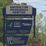 A blue sign from the street view that says "Bruceston Research Center" and "Pittsburgh Mining Research Division"