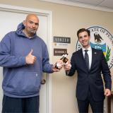 Rep. Deluzio and Sen. Fetterman pose with an Iron City
