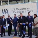 A photo of Congressman Deluzio cutting a ribbon to mark the opening of a new VA clinic in Monroeville
