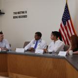 Rep. Deluzio sits at a table with healthcare providers and advocates to talk about abortion rights.