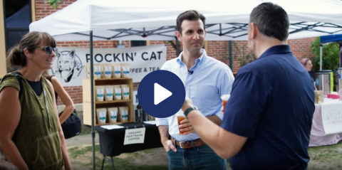 Rep. Deluzio speaks with constituents at a farmer's market